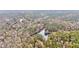 Scenic aerial shot of a winding lake surrounded by dense woodlands at 408 Gray Fox Dr, Canton, GA 30114