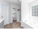 Bathroom features a walk-in shower, soaking tub, and neutral tile and vanity at 408 Gray Fox Dr, Canton, GA 30114