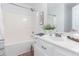 Bathroom featuring a shower-tub combo and vanity with stylish décor at 408 Gray Fox Dr, Canton, GA 30114