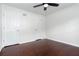 This bright bedroom boasts hardwood floors, a ceiling fan, and two closets for ample storage at 408 Gray Fox Dr, Canton, GA 30114