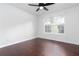 Bright bedroom features dark wood floors, ceiling fan and large window for natural light at 408 Gray Fox Dr, Canton, GA 30114