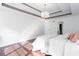 Bedroom features hardwood floors, tray ceilings, ceiling fan, and a large window at 408 Gray Fox Dr, Canton, GA 30114