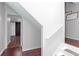 Hallway features wooden stairs, luxury vinyl plank flooring, and a sliding barn door at 408 Gray Fox Dr, Canton, GA 30114