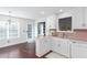 Charming kitchen with white cabinetry, stainless appliances, and hardwood floors at 408 Gray Fox Dr, Canton, GA 30114