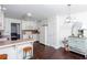 Eat-in kitchen featuring white cabinets, breakfast bar, and stainless steel appliances at 408 Gray Fox Dr, Canton, GA 30114