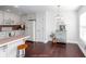 Eat-in kitchen showcasing white cabinets, stainless steel appliances, and hardwood floors at 408 Gray Fox Dr, Canton, GA 30114
