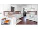 Well-lit kitchen with updated appliances, white cabinetry, and breakfast bar seating at 408 Gray Fox Dr, Canton, GA 30114