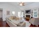 Bright living room features vaulted ceiling, fireplace, built-ins, hardwood floors, and neutral decor at 408 Gray Fox Dr, Canton, GA 30114