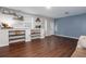 Cozy living room features luxury vinyl plank flooring, built-in shelves and bright windows at 408 Gray Fox Dr, Canton, GA 30114