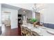 Open concept living and dining areas with hardwood floors and views to the foyer at 408 Gray Fox Dr, Canton, GA 30114