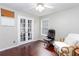 Office space with French doors, hardwood floors, and comfortable seating area at 408 Gray Fox Dr, Canton, GA 30114