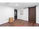 An open room has luxury vinyl plank flooring, a sliding barn door, and recessed lighting at 408 Gray Fox Dr, Canton, GA 30114