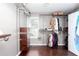 Walk-in closet with custom storage, hanging racks, shelving, and hardwood floors at 408 Gray Fox Dr, Canton, GA 30114