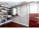 Walk-in closet features built-in organizers and shelving and dark wood flooring at 408 Gray Fox Dr, Canton, GA 30114