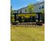 Community sign for Chestnut Grove featuring manicured landscaping, located in quiet residential area at 5004 Elowen Ln, Douglasville, GA 30135