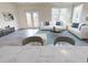 Open concept living area featuring modern furniture, hardwood floors, and bright natural light at 5004 Elowen Ln, Douglasville, GA 30135