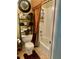 Cozy bathroom with a shower-tub combo, decorative curtains, and a storage shelf at 5430 Lemoyne Sw Dr, Atlanta, GA 30331