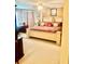 Spacious bedroom with a ceiling fan, carpet, and a large bed with decorative pillows at 5430 Lemoyne Sw Dr, Atlanta, GA 30331