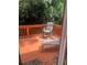 Outdoor deck area features wooden planks, chairs and wooded surroundings at 5430 Lemoyne Sw Dr, Atlanta, GA 30331