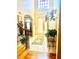 Bright foyer with tile flooring, high ceilings, and a decorative rug leading to the front door at 5430 Lemoyne Sw Dr, Atlanta, GA 30331