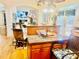 Spacious kitchen featuring a large island, granite countertops, and chairs for seating at 5430 Lemoyne Sw Dr, Atlanta, GA 30331