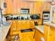Well-equipped kitchen with wooden cabinets, granite countertops, and modern stainless steel appliances at 5430 Lemoyne Sw Dr, Atlanta, GA 30331