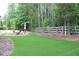 Expansive backyard featuring a pristine lawn area perfect for outdoor activities at 6570 Canyon Cv, Cumming, GA 30028