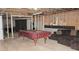 Basement space with a pool table and couch, offering recreational potential at 6570 Canyon Cv, Cumming, GA 30028