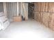 Unfinished basement with exposed insulation, perfect for customization and storage at 6570 Canyon Cv, Cumming, GA 30028