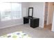 Bright bedroom with a modern desk, window, and closet at 6570 Canyon Cv, Cumming, GA 30028