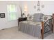 Cozy bedroom with a decorative daybed near a window at 6570 Canyon Cv, Cumming, GA 30028