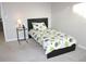 Light-filled bedroom with a comfortable single bed and stylish side table at 6570 Canyon Cv, Cumming, GA 30028