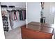 Spacious walk-in closet with ample hanging space and an antique wooden chest at 6570 Canyon Cv, Cumming, GA 30028