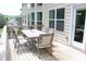 Outdoor deck area with a dining table set perfect for entertaining and relaxation at 6570 Canyon Cv, Cumming, GA 30028