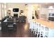 Open-concept kitchen with an island that seamlessly connects to the living area at 6570 Canyon Cv, Cumming, GA 30028