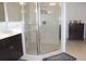 Contemporary main bathroom showcasing a glass shower, vanity, and tile flooring at 6570 Canyon Cv, Cumming, GA 30028