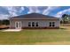 Spacious backyard featuring a well-maintained lawn, patio, and privacy fence at 1278 Hollingsworth Way, Dacula, GA 30019