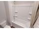 Clean bathroom with a tub and shower combination, featuring a white shower curtain at 1278 Hollingsworth Way, Dacula, GA 30019
