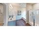 Well-lit bathroom with double vanity, soaking tub, and walk-in shower at 1278 Hollingsworth Way, Dacula, GA 30019