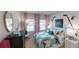 Bright bedroom with large window, a comfortable bed, and decorative hockey sticks on the wall at 1278 Hollingsworth Way, Dacula, GA 30019