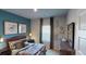Warm bedroom with comfortable bed, decorative pillows, matching nightstands and a large window at 1278 Hollingsworth Way, Dacula, GA 30019