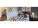 Bedroom featuring a door to the bathroom, comfortable bed, matching nightstands and decorative wall decor at 1278 Hollingsworth Way, Dacula, GA 30019