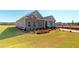 Charming brick and siding home with landscaped yard, a well manicured lawn, and beautiful flowerbeds at 1278 Hollingsworth Way, Dacula, GA 30019