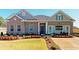 Beautiful brick home with manicured lawn and colorful flowerbeds enhances curb appeal at 1278 Hollingsworth Way, Dacula, GA 30019