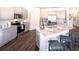 Modern kitchen with granite countertops, island with seating, and stainless appliances at 1278 Hollingsworth Way, Dacula, GA 30019