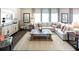 Inviting living room featuring a large sectional sofa and stylish decor at 1278 Hollingsworth Way, Dacula, GA 30019