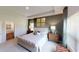 Cozy main bedroom with a tufted headboard bed and lots of natural light at 1278 Hollingsworth Way, Dacula, GA 30019