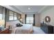 Serene main bedroom featuring tray ceilings and comfortable furnishings at 1278 Hollingsworth Way, Dacula, GA 30019