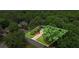 Aerial view of home and property within lush, wooded neighborhood at 134 Waterloch Ct, Lawrenceville, GA 30043