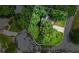 Aerial view of home and property with wooded surroundings at 134 Waterloch Ct, Lawrenceville, GA 30043